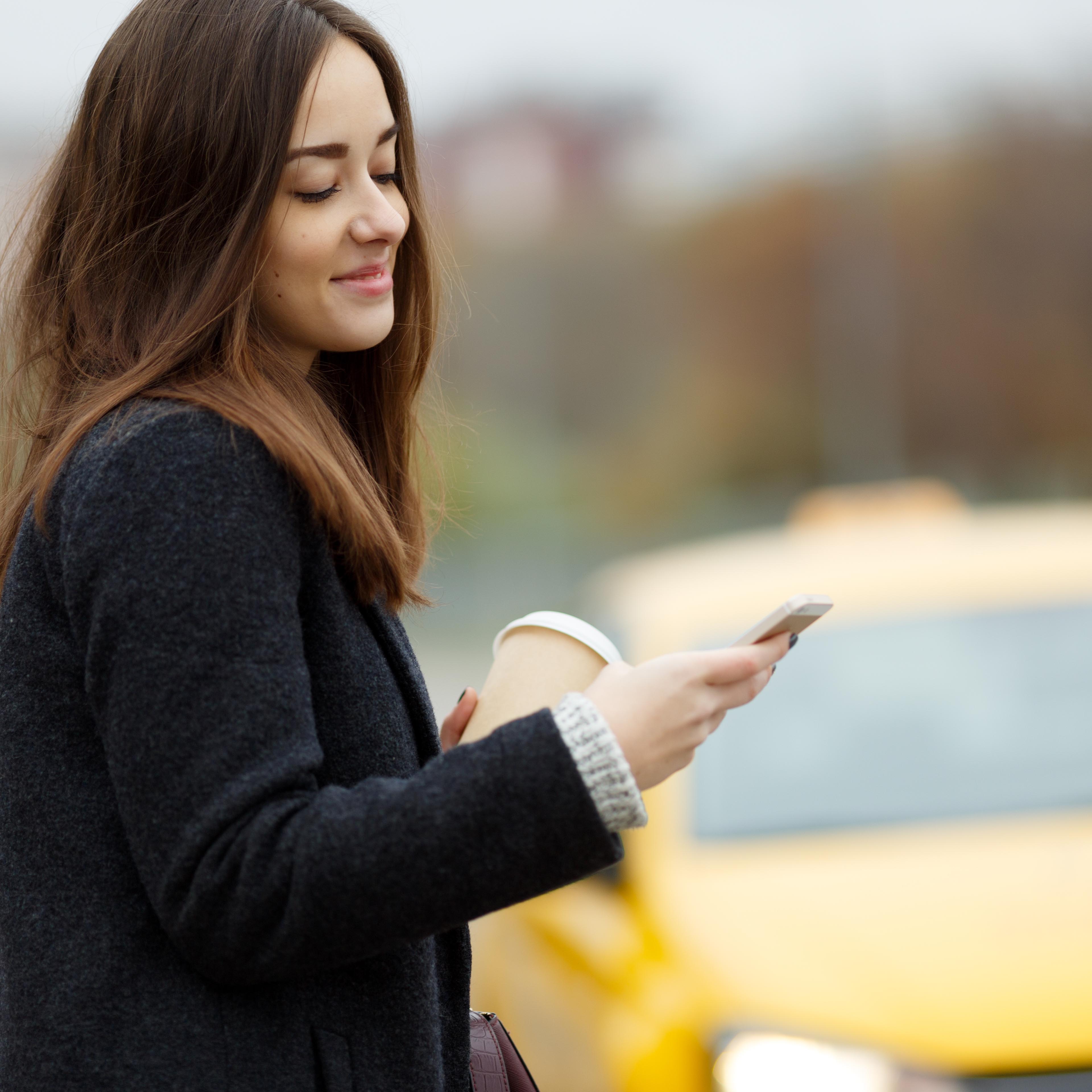 lady using ARRO to book a taxi